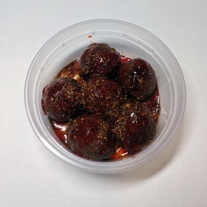 SlobberBalls covered in chamoy sauce and tajin.