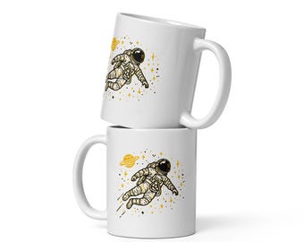 Taza de Astronauta: Flotando en el Espacio con Estrellas y Planetas