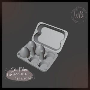 May include: A grey plastic egg carton with six empty slots and three eggs in the slots. The carton is open and the lid is off. The text "Stl Files 1:6 scale & 1:12 scale" is written below the carton.