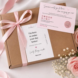 A box showing a 30th birthday present for her with pink number 30 birthday treats and personalised gift in a pink box with a pink bow