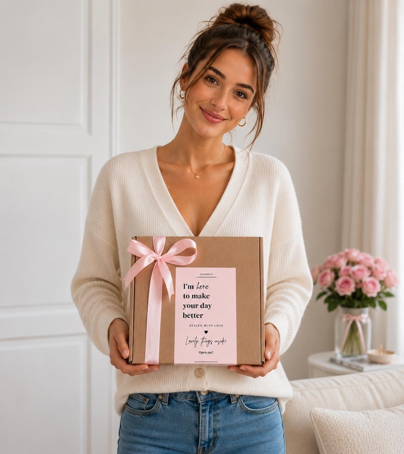 A woman holding a 30th birthday gift box for women filled with beauty treats, sweets, socks and birthday gifts