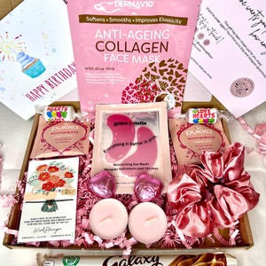 May include: A gift box containing a DermaV10 anti-ageing collagen face mask, two Pukka Womankind tea bags, Grace & Stella eye masks, two pink tea light candles, two heart-shaped chocolates, a pink scrunchie, a WishStrings bracelet, and a Galaxy Ripple bar.