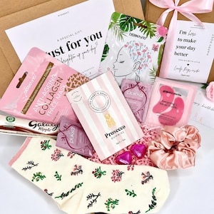 30th birthday letterbox gift for her with eye masks, face masks, chocolates and pink satin accessories
