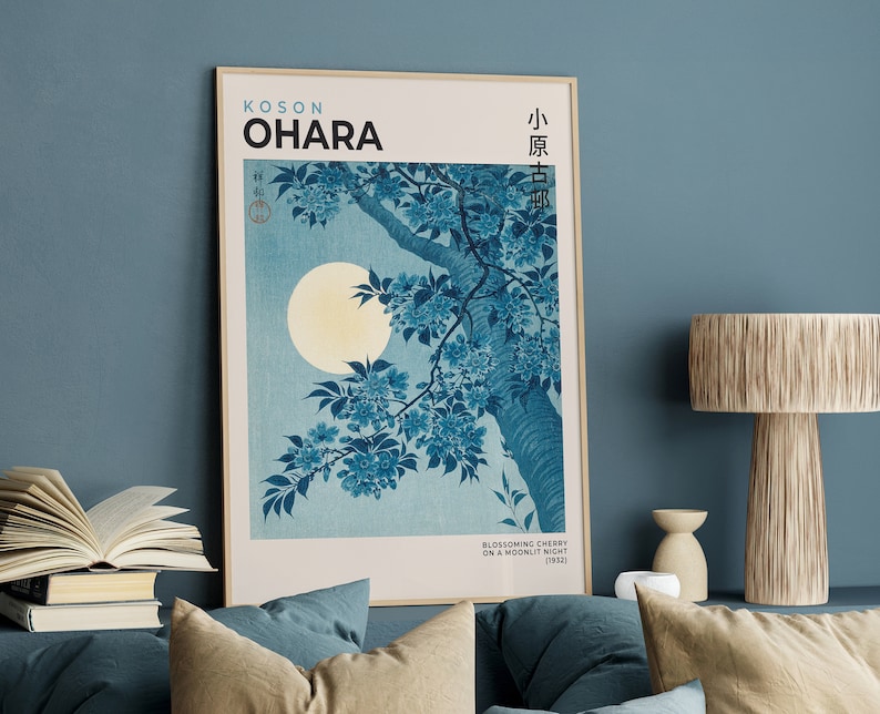 May include: A framed print of a Japanese woodblock print depicting a cherry blossom branch with a full moon in the background. The print is titled "Blossoming Cherry on a Moonlit Night (1943)" and is signed "Koson Ohara".