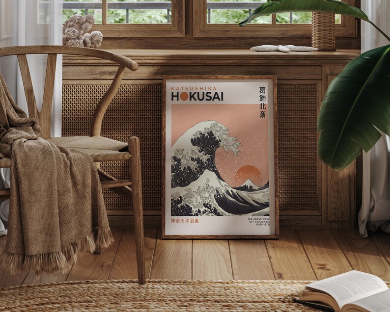 May include: A framed print of "The Great Wave off Kanagawa" by Katsushika Hokusai. The print features a large wave with Mount Fuji in the background. The text "KATSUSHIKA HOKUSAI" and "神奈川沖浪裏" is printed in the bottom left corner.