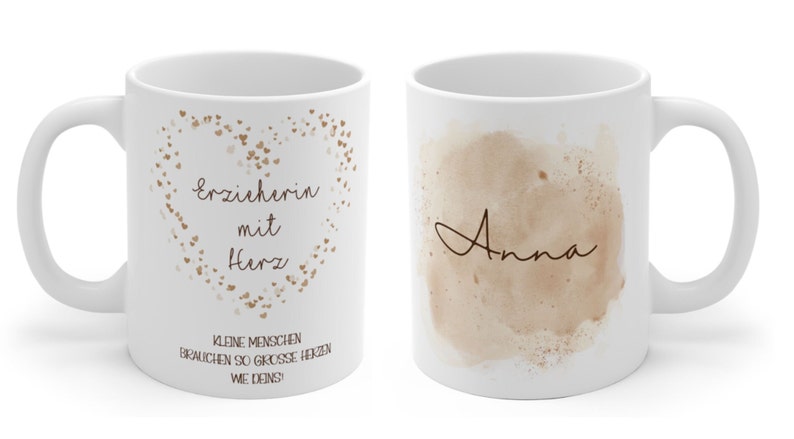 May include: White ceramic mug with a brown heart design and the text "Erzieherin mit Herz" and "Kleine Menschen brauchen so grosse Herzen wie deins!" on one side. The other side of the mug has a brown watercolor design with the name "Anna" written in cursive.