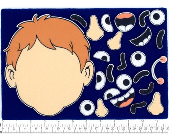 May include: A felt craft activity set with a boy's face outline and various felt pieces to create different expressions. The pieces include eyes, noses, mouths, eyebrows, and ears. The background is a dark blue felt.