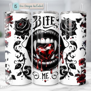 May include: White stainless steel tumbler with a gothic design. Features a vampire mouth with a heart-shaped gem, the words "Bite Me", and black roses. Includes a straw and the text "15 free designs included".