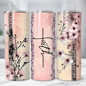 May include: Three stainless steel tumblers with floral and script designs. One features the word "Faith" in black script. The other two have pink flowers and black floral accents. Each tumbler has a clear straw.