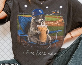 Limited Comfort Colors Raccoon I live Here Now T-Shirt, Raccoon Drinking Iced Coffee Graphic T-Shirt, Gift For Women and Man Unisex T-Shirt