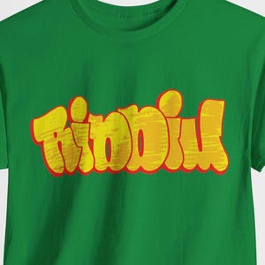 May include: Green t-shirt with the word "Riddim" in yellow and red letters.