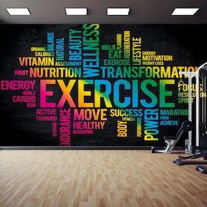 May include: A black chalkboard wall with colorful text that reads "EXERCISE" in large letters. The text is surrounded by other words related to fitness, health, and wellness, such as "energy", "nutrition", "transformation", "move", "success", "healthy", and "power".