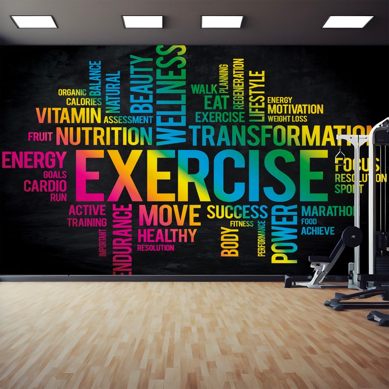 May include: A black chalkboard wall with colorful text that reads "EXERCISE" in large letters. The text is surrounded by other words related to fitness, health, and wellness, such as "energy", "nutrition", "transformation", "move", "success", "healthy", and "power".
