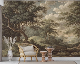 May include: A scenic wallpaper mural depicting a classical landscape with trees, hills, and a cloudy sky. The color palette is muted with greens, browns, and creams. A wicker chair with a cream cushion and a vase with tall, dried plants are in front of the mural.