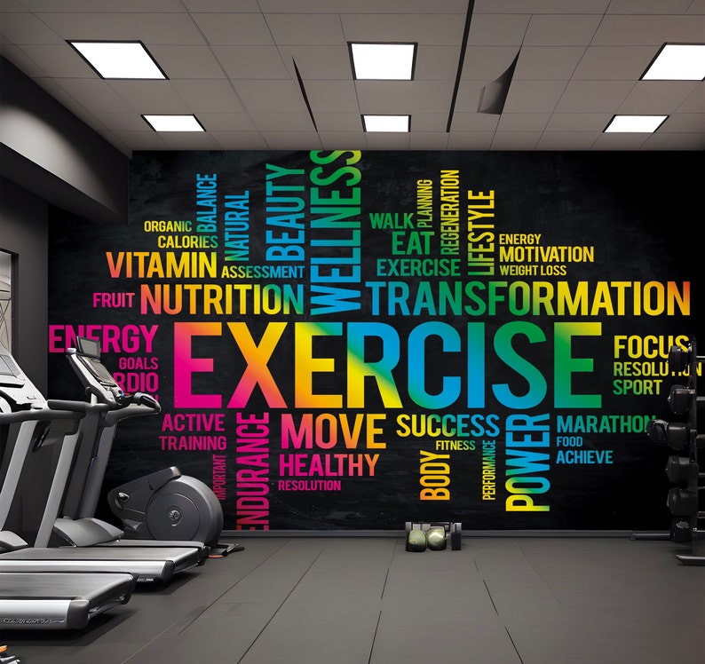 May include: A black chalkboard wall with colorful text that reads "EXERCISE" in large letters. The text is surrounded by other words related to fitness, health, and wellness, such as "nutrition", "transformation", "energy", "goals", "active", "training", "move", "success", "healthy", "resolution", "focus", "marathon", "achieve", "power", "body", "fitness", "performance", "regeneration", "lifestyle", "motivation", "weight loss", "walk", "planning", "eat", "fruit", "vitamin", "assessment", "balance", "beauty", "natural", "organic", "calories", "important", "endurance", "rdio", "sport", "resolution".