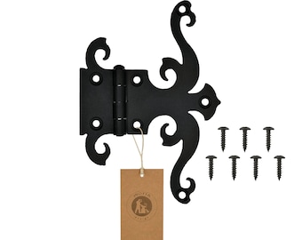 May include: Black ornate hinge with a decorative scroll design. The hinge is attached to a brown paper tag with the word "morio" and a logo. The hinge comes with eight black screws.