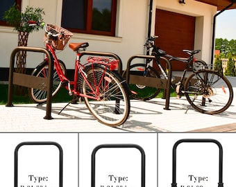 May include: Three black metal bike racks with different types of mounting. The racks are labeled with the types: B-01.60.b.zn, B-01.60.k.zn, and B-01.60.o.zn.