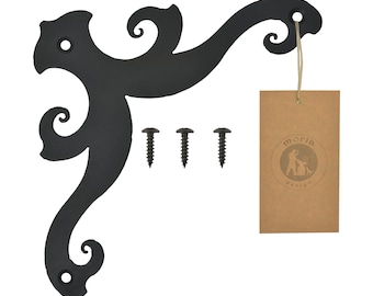 May include: Black metal corner bracket with a decorative scroll design. The bracket comes with three black screws. The bracket is labeled with the text "moria design".