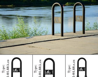 May include: Three black metal bike racks with a bicycle symbol on a white background. The racks are mounted on a concrete surface. The text "Type: B-04.60.b.zn" is on the left, "Type: B-04.60.k.zn" is in the middle, and "Type: B-04.60.o.zn" is on the right.