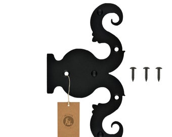 May include: Black metal decorative hinge with a scroll design. The hinge has three mounting holes and comes with three screws.