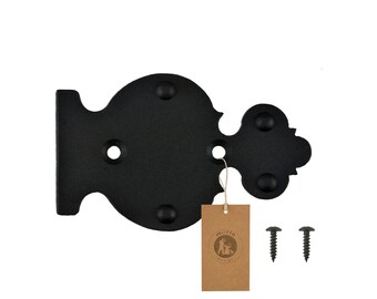 May include: Black metal hinge with a decorative design. The hinge has four round decorative accents and comes with two screws.