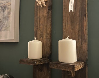 Pair of rustic wooden wall scones with lovely rope detail. Pillar candles included.