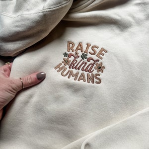 Raising kind humans sweatshirt outlet