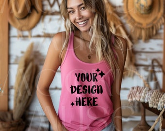 May include: A pink tank top with the text "YOUR DESIGN HERE" in black. The tank top is worn by a person with long blonde hair.