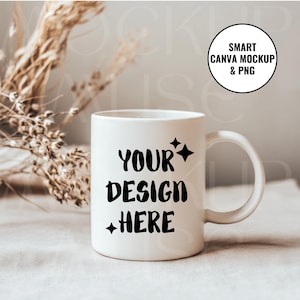 May include: White ceramic mug with a black design that says "YOUR DESIGN HERE" with stars on either side of the text. The mug is sitting on a light brown surface.