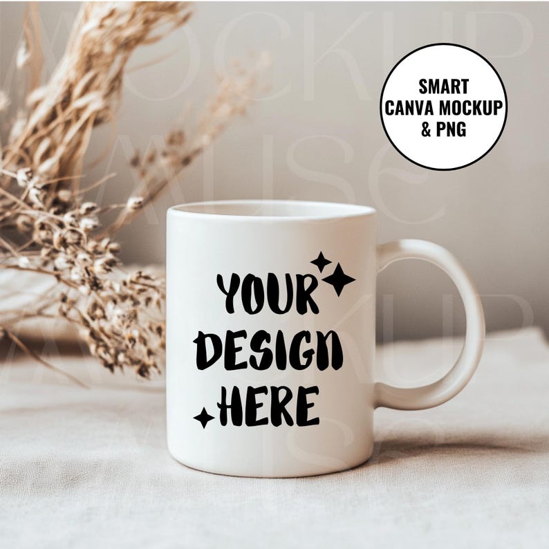 May include: White ceramic mug with a black design that says "YOUR DESIGN HERE" with stars on either side of the text. The mug is sitting on a light brown surface.