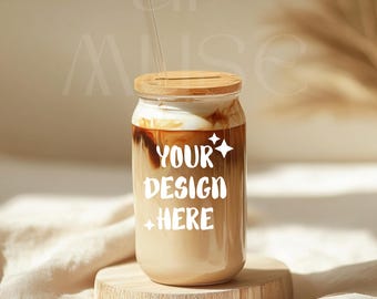 May include: A glass jar with a bamboo lid and a straw filled with iced coffee. The coffee has a layer of cream on top and the text "YOUR DESIGN HERE" is printed on the side of the jar.