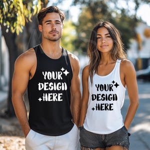 May include: Two tank tops with the text "YOUR DESIGN HERE" in white lettering on a black and white background. The tank tops are worn by two people standing outdoors.