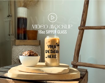 May include: A 16oz clear glass with a straw and iced coffee. The glass has the text "Your Design Here" on it. The glass is sitting on a wooden coaster.