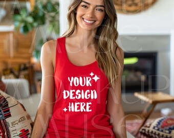Puede incluir: Un top rojo sin mangas con el texto "YOUR DESIGN HERE" en blanco. El top está siendo usado por una persona con cabello largo y castaño.