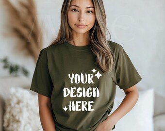 May include: A woman wearing a green t-shirt with the text "YOUR DESIGN HERE" in white. The shirt has a relaxed fit and is made of a soft, comfortable fabric.