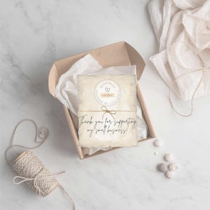 May include: A handmade gift box with a card that reads "Thank you for supporting my small business!" The card is tied with twine and features a circular design that says "Handmade by Lisa Adele". The box is filled with white tissue paper.