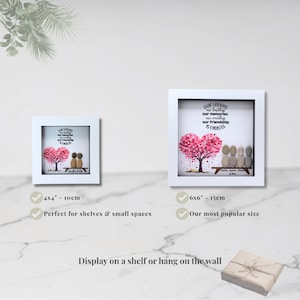 May include: Two framed art pieces with white borders. The art features a pink heart-shaped tree and pebble figures. Text reads "Our laughs are limitless, our memories are countless, our friendship is endless." One frame is 4x4 inches (10cm), the other is 6x6 inches (15cm).