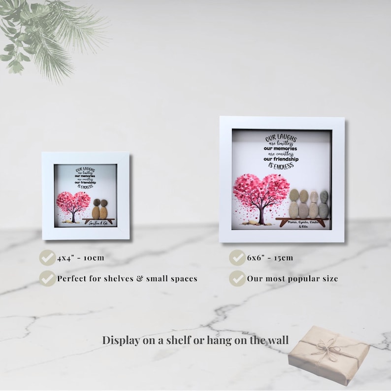 May include: Two framed art pieces with white borders. The art features a pink heart-shaped tree and pebble figures. Text reads "Our laughs are limitless, our memories are countless, our friendship is endless." One frame is 4x4 inches (10cm), the other is 6x6 inches (15cm).