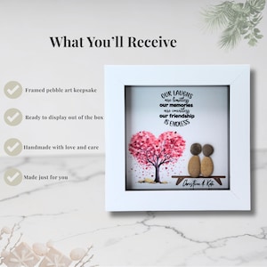May include: A white framed pebble art keepsake with the text "OUR LAUGHS are limitless, our memories are countless, our friendship IS ENDLESS." The art features a pink heart-shaped tree and two pebble figures. Signed "Christine & Kate."