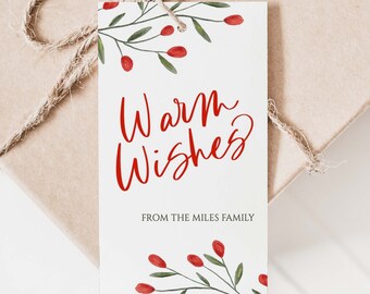 May include: White gift tag with red watercolor holly sprigs and the text "Warm Wishes" in red script. Below the text is "From the Miles Family" in black text.