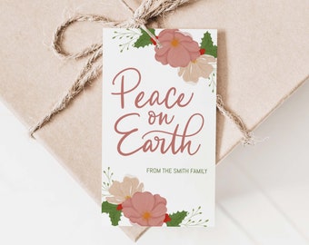 May include: A white gift tag with pink and white flowers and green leaves. The text on the tag reads "Peace on Earth" with the words "From the Smith Family" below.
