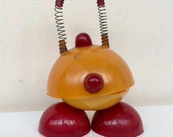 Vintage Soviet USSR Toy Chuni-Muni made of hard plastic Yellow-Red color with springs and magnets. Trembling figurine . Fridge Magnet.