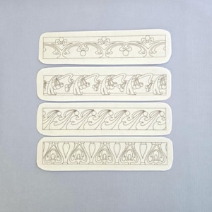 May include: A white ceramic mug with a black handle and the text "But First, Coffee" in a handwritten style. The mug is on a white surface. The mug is 4 inches tall.