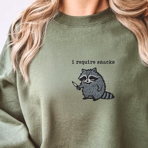 I require snacks sweatshirt, feral embroidered raccoon sweater, funny cozy gildan 18000, funny unhinged gift, embroidered animal sweatshirt