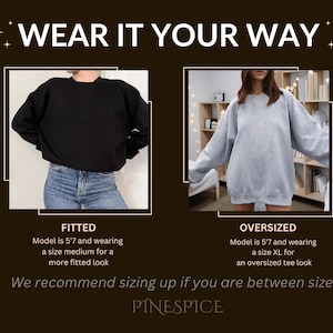 May include: The image showcases two sweatshirt styles: fitted and oversized. The text "WEAR IT YOUR WAY" is at the top. The fitted style is black, and the oversized style is gray. The text recommends sizing up if between sizes. The brand name is PINESPICE.