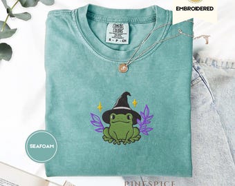 Witchy Frog with Boo Basket Embroidered Tee – Cute Halloween Comfort Colors® Shirt, Fall Cottagecore Frog Gift, Spooky Season Tee