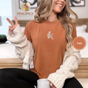 Skeleton reading book tee, embroidered skeleton coffee shirt, spooky book lover t-shirt, comfort colors 1717 fall vibes shirt, boo basket