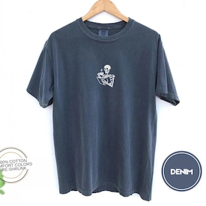 Embroidered Skeleton Reading a Book Shirt – Comfort Colors Book Lover Tee Cozy Aesthetic Embroidery Dark Academia Spooky Season Reader Shirt