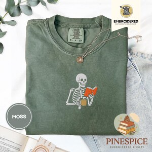 Skeleton reading book tee, embroidered skeleton coffee shirt, spooky book lover t-shirt, comfort colors 1717, fall vibes shirt, boo basket