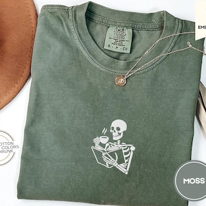 Embroidered Skeleton Reading a Book Shirt – Comfort Colors Book Lover Tee Cozy Aesthetic Embroidery Dark Academia Spooky Season Reader Shirt